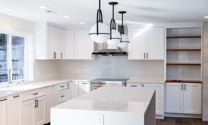Elegant modern white kitchen with minimalist design and natural light. Perfect for cooking and entertaining.
