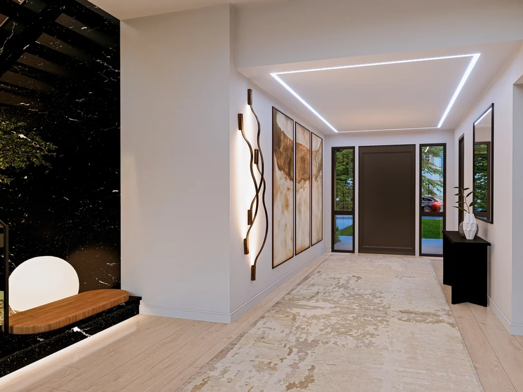 Elegant modern hallway design featuring marble, art, and natural light for a welcoming ambiance.