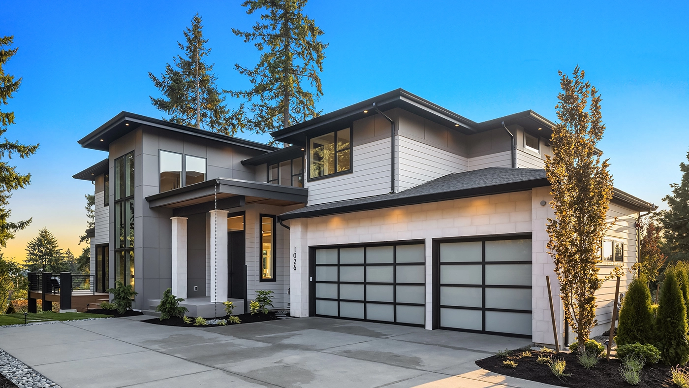 Modern residence with sleek design and natural surroundings, featuring stylish architecture and lush greenery.