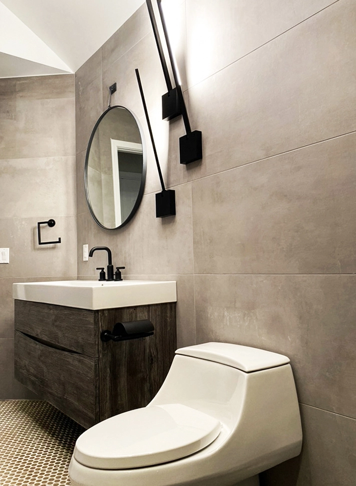 Stylish modern bathroom design featuring minimalist decor, sleek vanity, and elegant lighting solutions.
