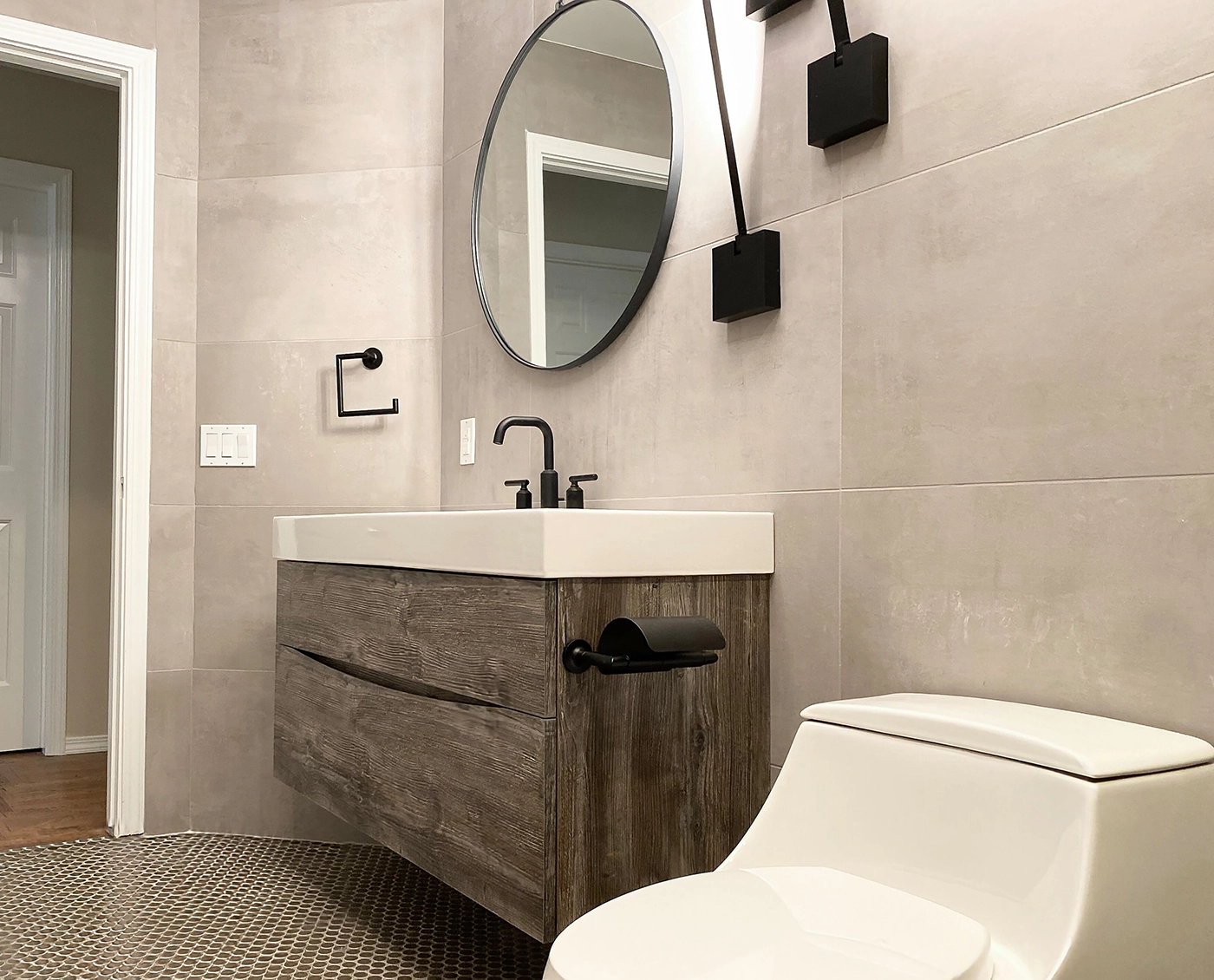 Stylish modern minimalist bathroom with wooden vanity, sleek fixtures, and serene lighting accents.