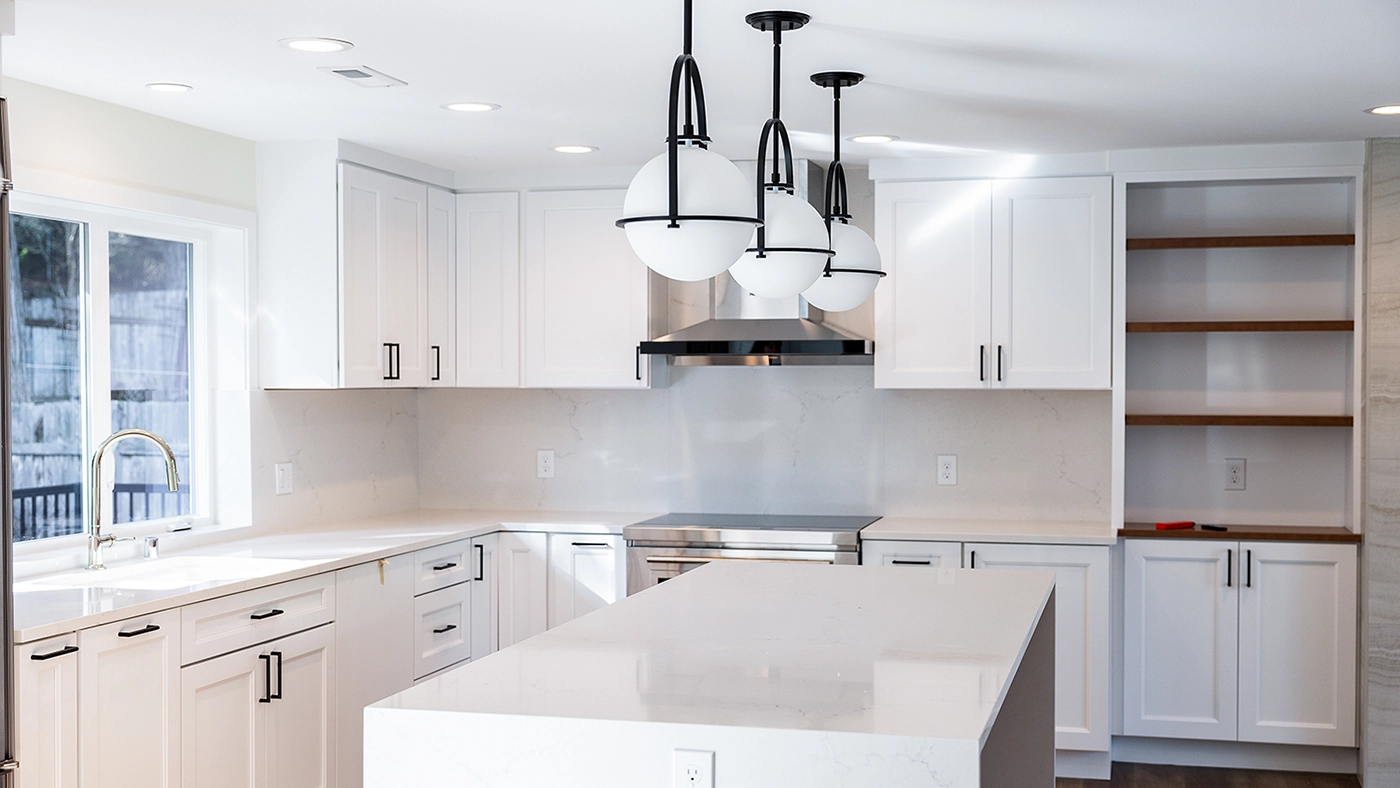 Bright and modern kitchen featuring sleek cabinetry, a spacious island, and contemporary appliances, showcasing a stylish and functional design.