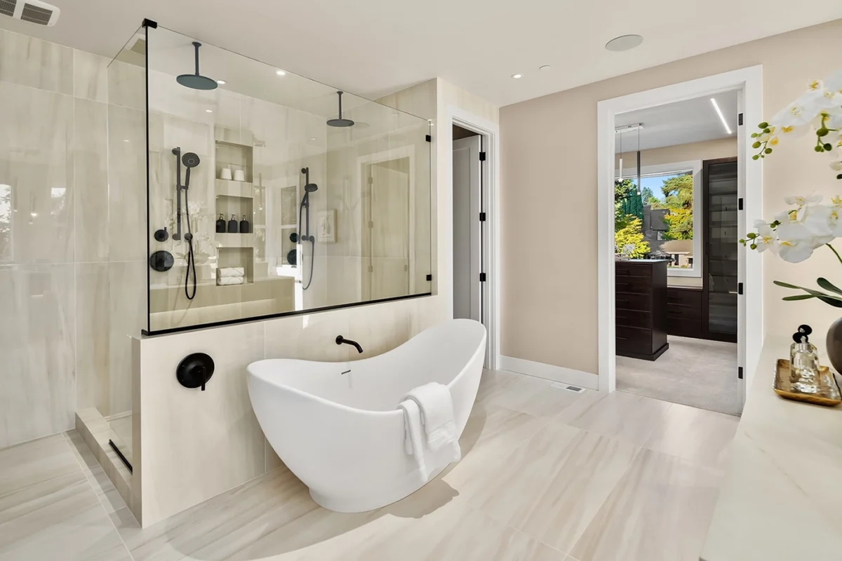 Luxurious modern bathroom featuring a sleek freestanding tub and elegant shower enclosure.