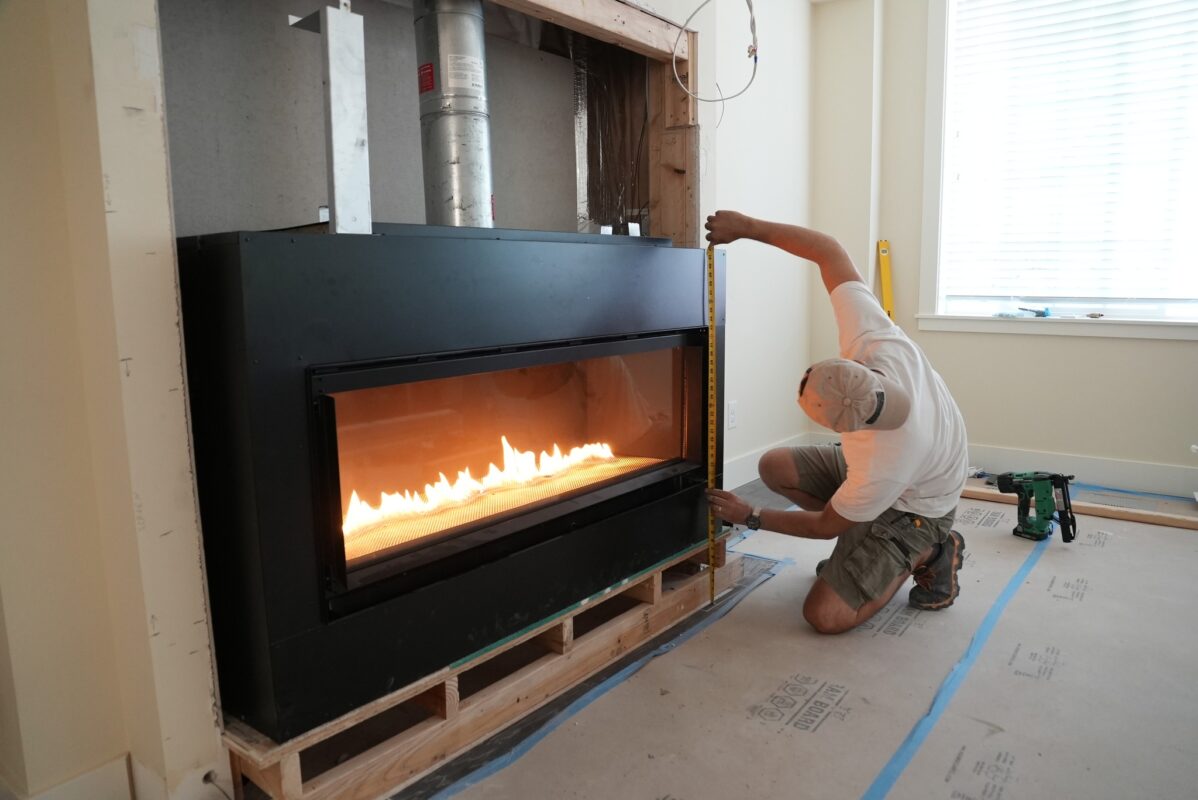 Modern fireplace installation with sleek design in a cozy remodeling project.